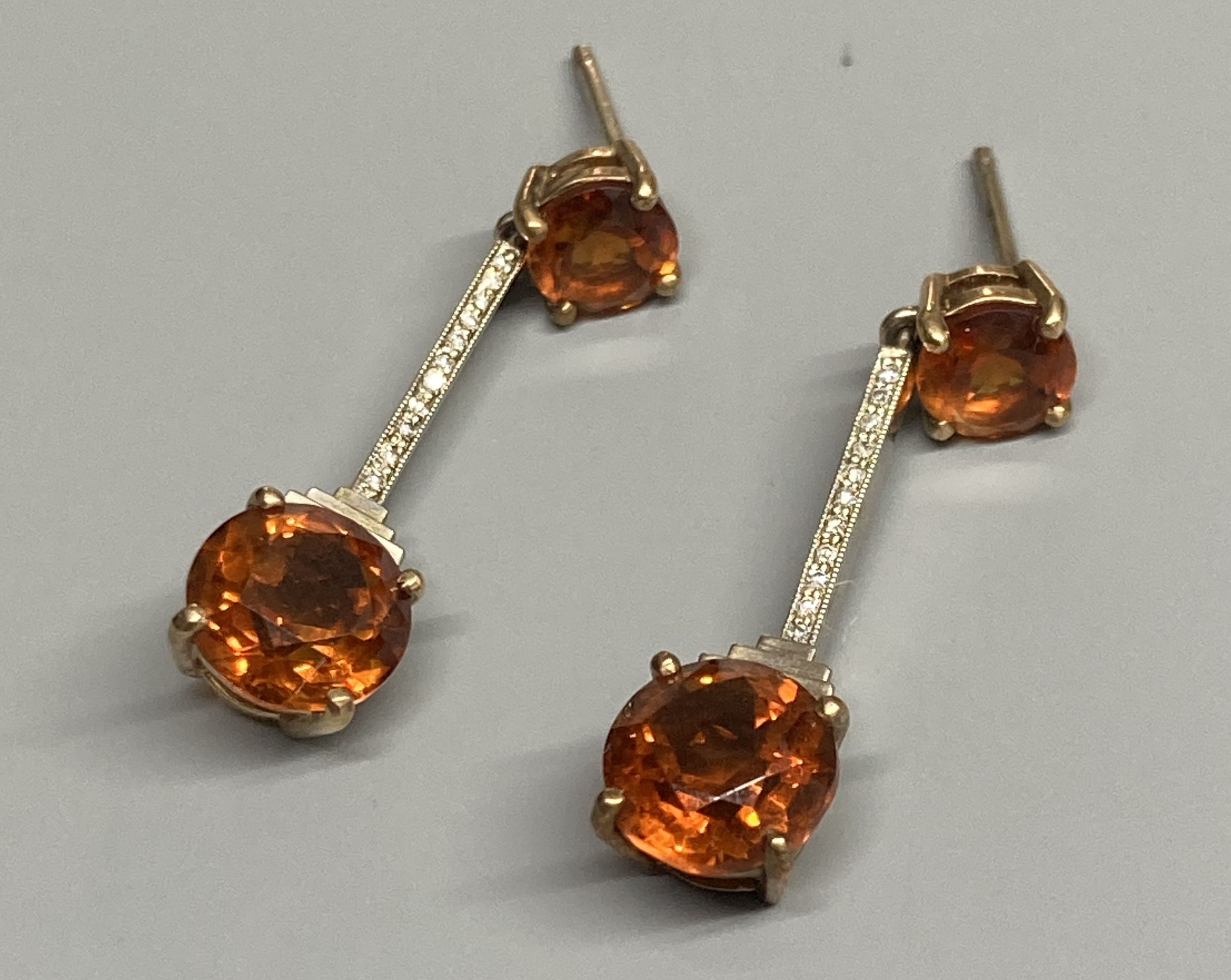 A pair of Art Deco style yellow and white metal, citrine and diamond chip set drop earrings, (no butterflies), 32mm, gross weight 3.8 grams.